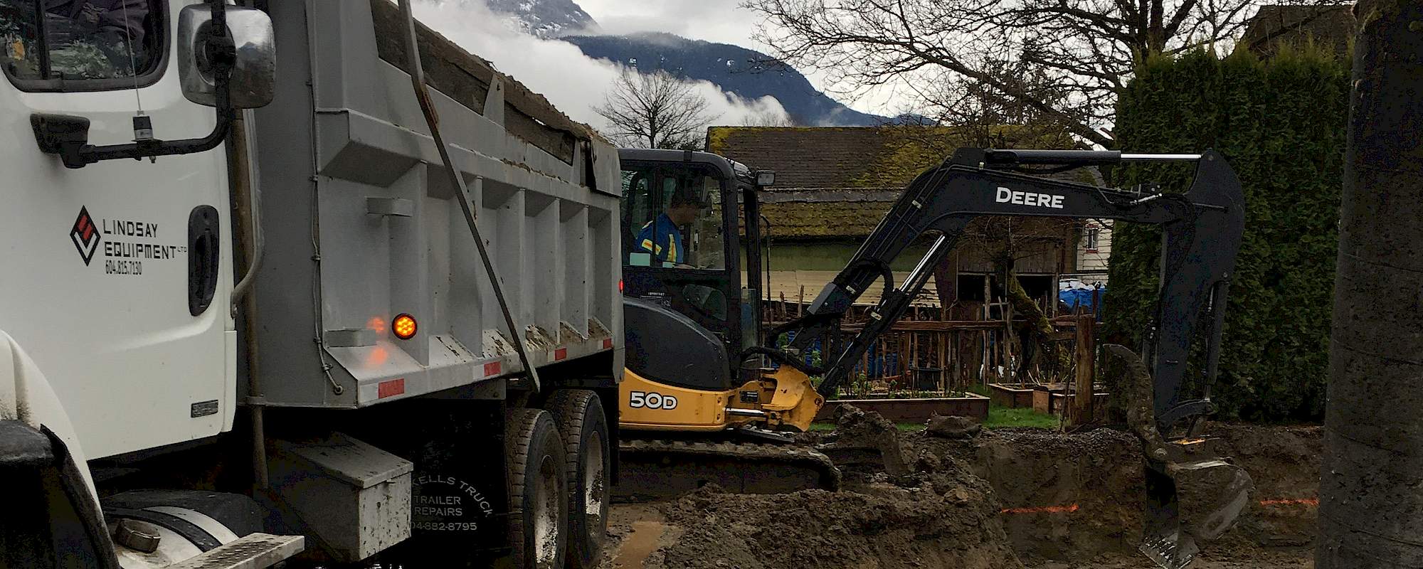 Excavator filling a truck in Squamish BC