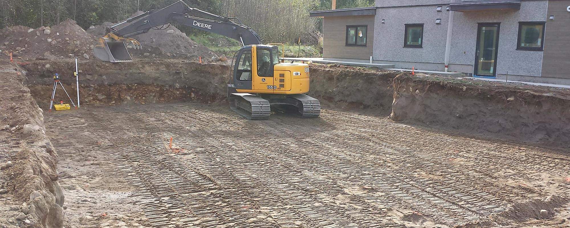 Excavator preparing a construction site in Squamish